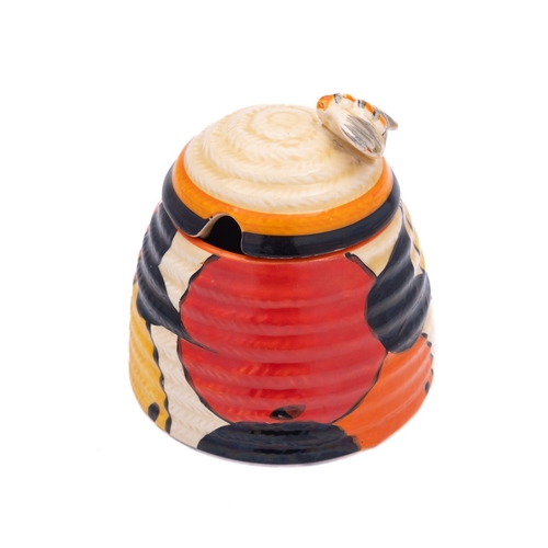 154 - A Clarice Cliff Beehive preserve pot and cover, enamelled in the Oranges and Lemons pattern, Bizarre... 