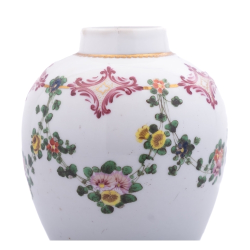 166 - A Champion's Bristol tea canister of ovoid form painted with a continuous floral garland suspended f... 