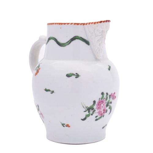 193 - A Champion's Bristol mask jug painted with flower sprays and sprigs below a wavy band of green drape... 