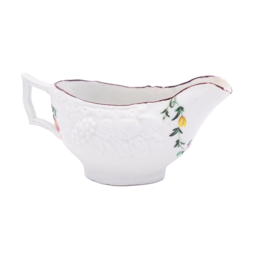 199 - A rare Champion's Bristol butterboat with flattened angular handle, moulded with fruit and painted w... 