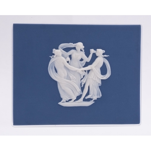 247 - A Wedgwood dark blue jasper ware plaque sprigged in white with the Three Graces, 9 x 12cm, set in a ... 