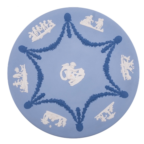 247 - A Wedgwood dark blue jasper ware plaque sprigged in white with the Three Graces, 9 x 12cm, set in a ... 