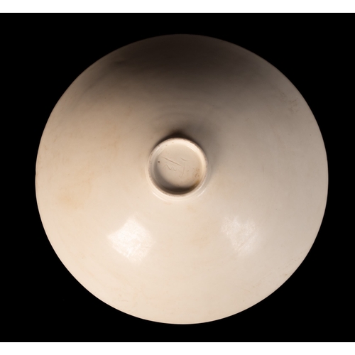 25 - A Chinese Ding-ware 'Dragon' bowl, Song dynasty of conical form with short footrim, the interior mou... 