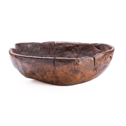 286 - A large burr walnut bowl, probably 19th century; rough hewn from a solid piece, of loosely oval sect... 