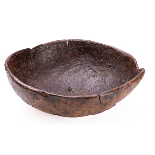 286 - A large burr walnut bowl, probably 19th century; rough hewn from a solid piece, of loosely oval sect... 