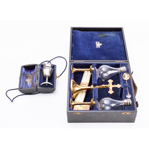 341 - A cased brass and glass travelling Communion set, mid 20th century; by AR Mowbray & Co., London; com... 