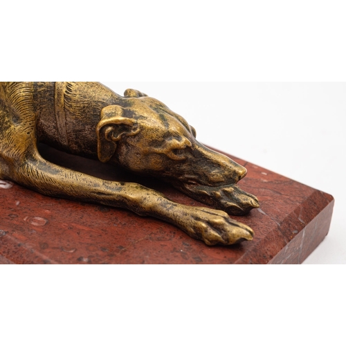 378 - A bronze and marble mounted model of a recumbent hound, late 19th century; naturalistically modelled... 