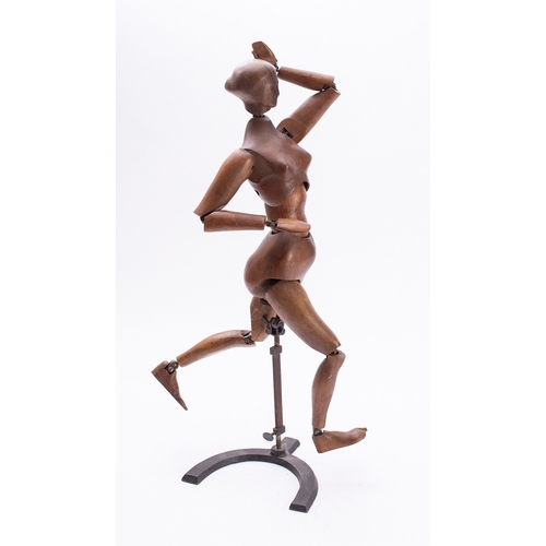 389 - A stained beechwood articulated lay female figure, early 20th century; with metal hinged joints, on ... 