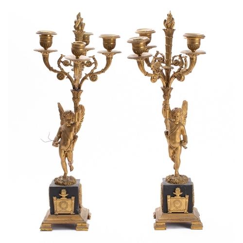 444 - A pair of Empire gilt and patinated bronze four light figural candelabra, early 19th century; each w... 