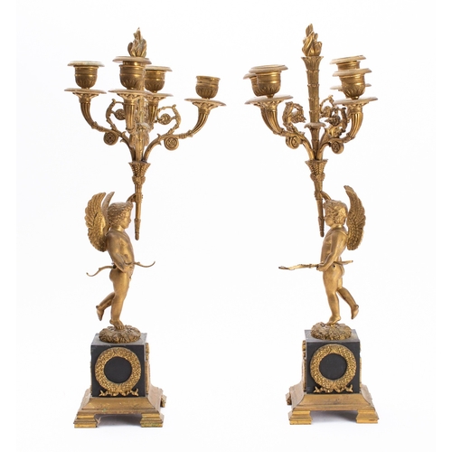 444 - A pair of Empire gilt and patinated bronze four light figural candelabra, early 19th century; each w... 