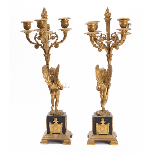 444 - A pair of Empire gilt and patinated bronze four light figural candelabra, early 19th century; each w... 