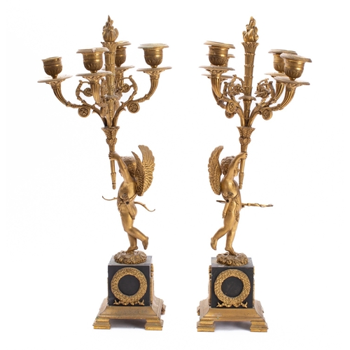 444 - A pair of Empire gilt and patinated bronze four light figural candelabra, early 19th century; each w... 