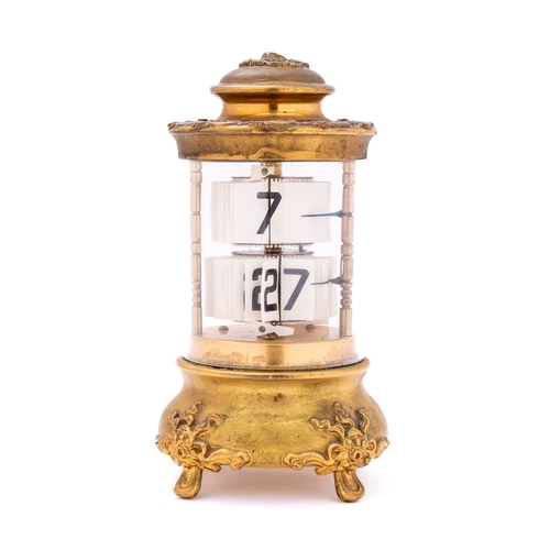 529 - Ansonia, The Plato Clock an American flip clock in a cylindrical case with glazed sides, the gilt-me... 