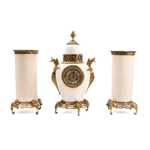 531 - A French gilt-metal and white pottery three-piece clock garniture the eight-day duration movement st... 