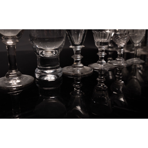 6 - A mixed group of glasses, primarily Dutch including an example with slender bell shaped bowl engrave... 