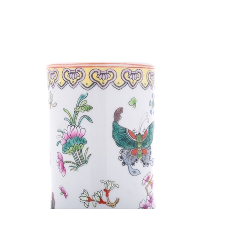 73 - A Chinese porcelain bottle vase painted in famille rose enamels with butterflies amongst prunus, chr... 