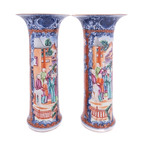 84 - A pair of Chinese porcelain sleeve vases of flaring cylindrical form painted in underglaze blue and ... 