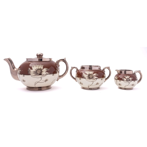 15 - A Gibson & Sons pottery three piece Silvoe Art Ware tea service, decorated with a band of ivory bloo... 