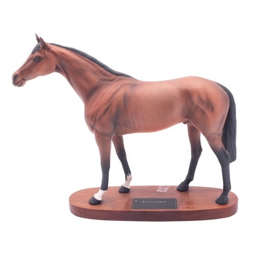 18 - A Beswick Connoisseur Series Racehorse, set on wooden base. [glue repair to ear].