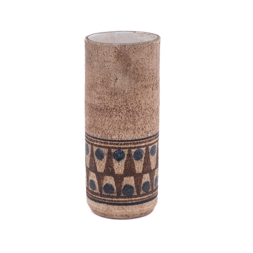 20 - A Troika pottery cylinder vase the textured exterior decorated with a band of 'teeth' motifs on a br... 