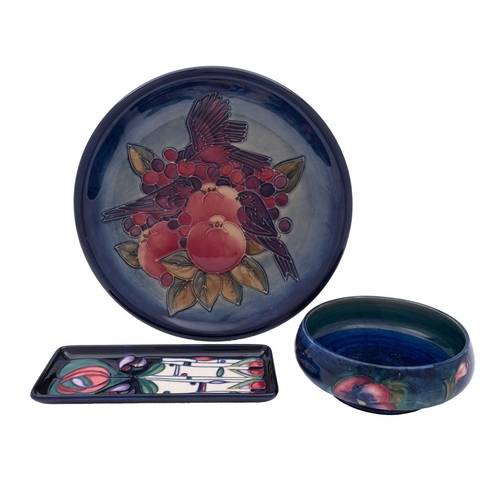 36 - A Walter Moorcroft shallow bowl in the Pansies pattern, impressed marks and facsimile signature, 15c... 