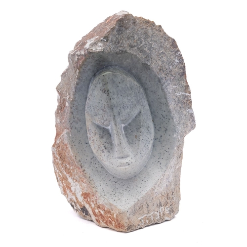 540 - An African soapstone or steatite sculpture in the form of a stylised visage, signed J. Type, 21cm hi... 