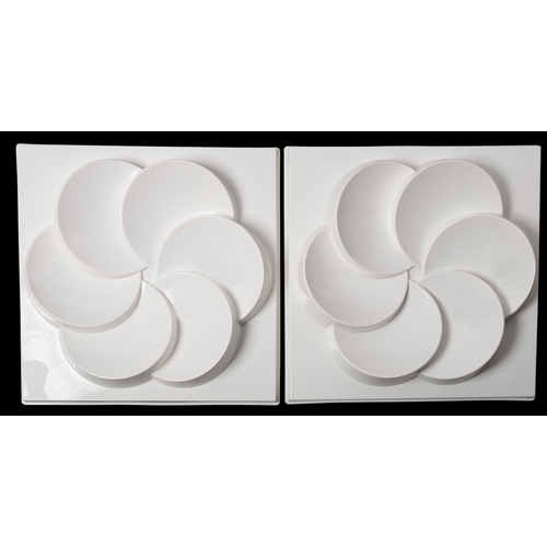 545 - A pair of vintage Ikea 'Rabatt' white plastic wall panels, injection moulded with overlying concave ... 