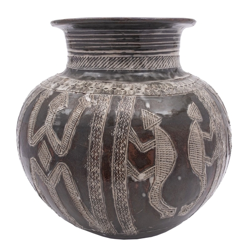 59 - Ladi Kwali [1925-1984] a stoneware water pot incised with panels of animals and fish, under an ash g... 