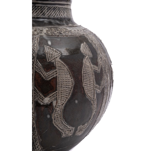 59 - Ladi Kwali [1925-1984] a stoneware water pot incised with panels of animals and fish, under an ash g... 