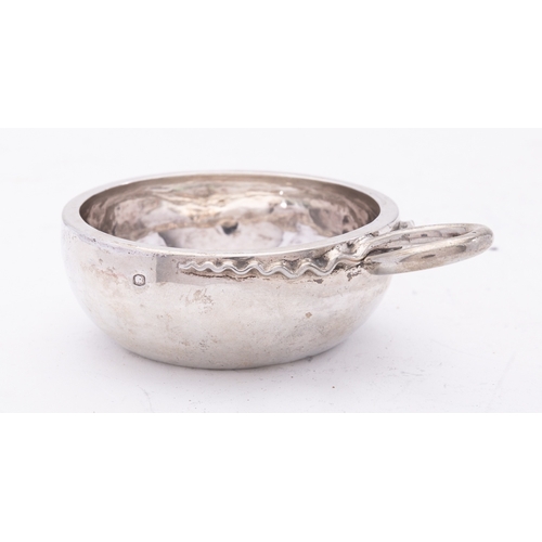 193 - An early 19th century French silver tastevin, marks on handle, side and base, of plain circular form... 