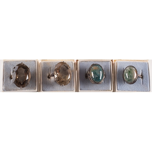 246 - A group of eleven stone set rings, including smokey quartz, moss agate, tiger's eye, amethyst and ci... 