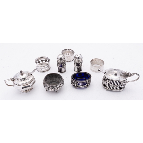 28 - A mixed group of silver including; a four piece cruet set comprising of a mustard pot, two pepperett... 