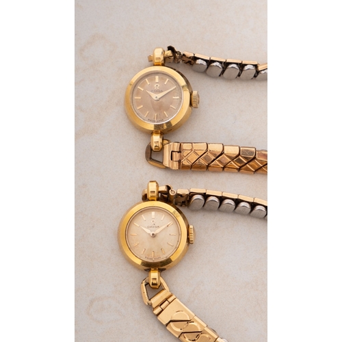 316 - Omega a pair of lady's 18ct gold wristwatches each with small round dials having raised baton numera... 