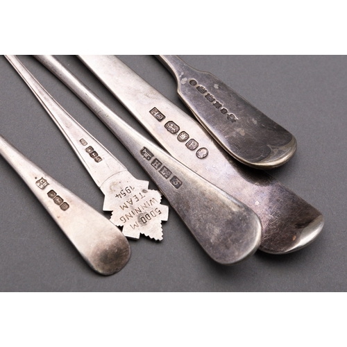 41 - A mixed group of silver flatware including; a George III silver Old English pattern gravy/ serving s... 