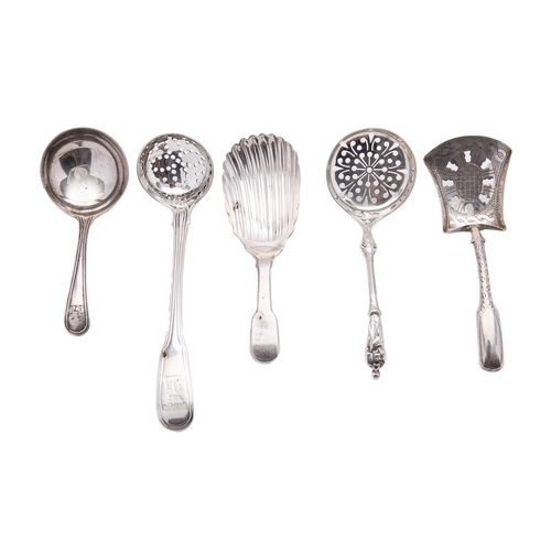 43 - A mixed group of silver spoons including; a George III Irish Fiddle pattern shell bowl caddy spoon b... 