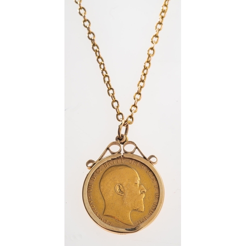 447 - A full sovereign in pendant mount with chain, an Edward VII 1908 full sovereign in a pendant mount, ... 