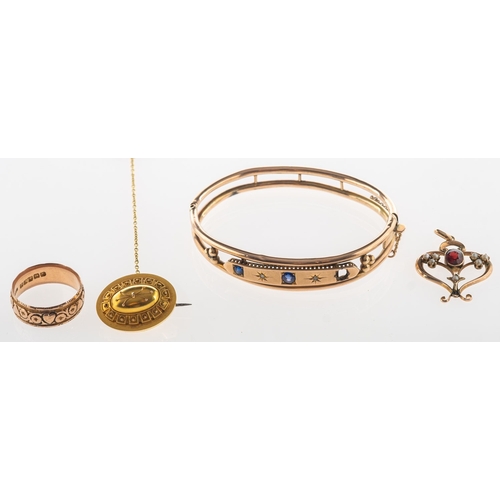 483 - A mixed group of jewellery, including a Victorian openwork hinged bangle, the front panel star set w... 