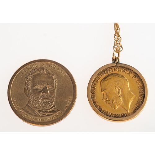 493 - A full sovereign in pendant mount with chain and one other coin, a 1913 George V full sovereign in a... 