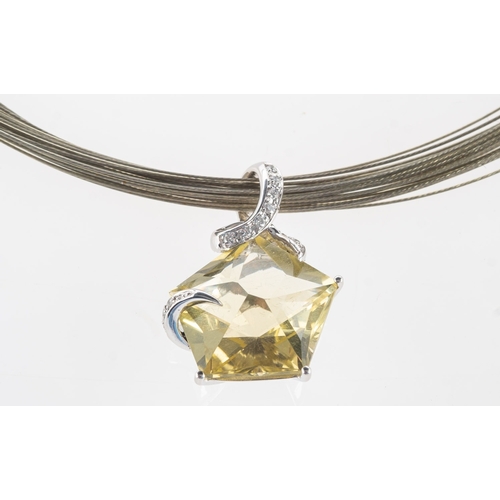 510 - A lemon quartz and diamond pendant with a wire necklet, a pendant set with a fancy 'star' cut lemon ... 