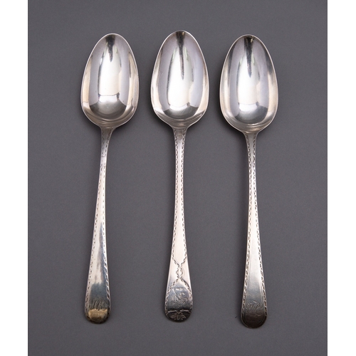 54 - A pair George III Bright-cut table spoons probably by Stephen Adams I, London 1779 and a similar tab... 