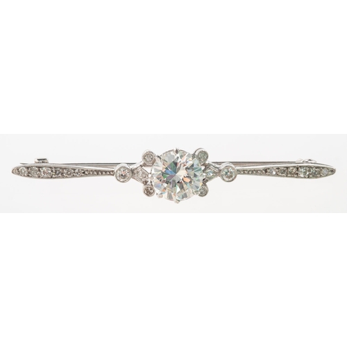 599 - A fine early 20th century diamond bar brooch, claw set to the centre with a transitional-cut diamond... 