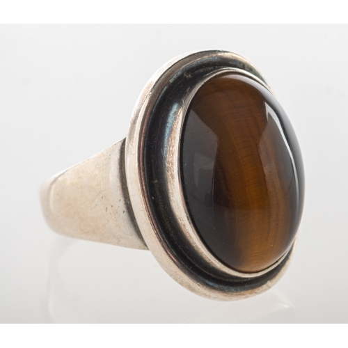 627 - Georg Jensen. A silver tiger's eye ring, number 46A, set with an oval tiger's eye cabochon, Import m... 