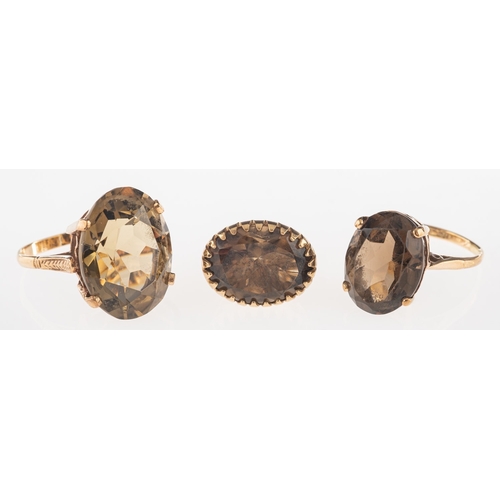 680 - A group of smokey quartz set jewellery, including a 9ct gold ring set with an oval-cut smokey quartz... 