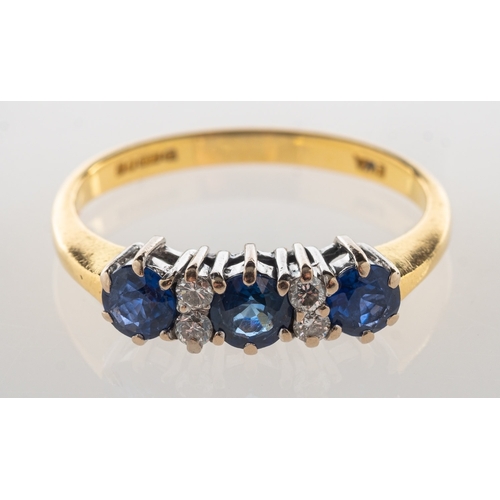 700 - An 18ct gold sapphire and diamond ring, claw set with three circular-cut sapphires, each sapphire in... 