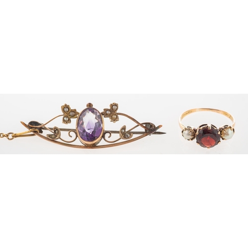 715 - A garnet and pearl ring and an amethyst and seed pearl brooch, an antique three stone ring, claw set... 