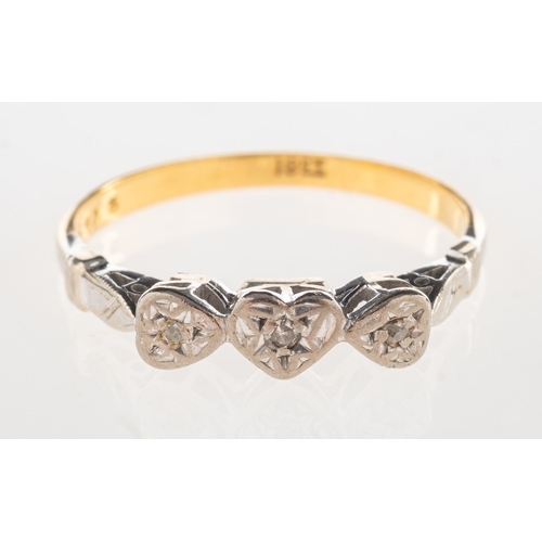 718 - A three stone diamond heart ring, set with two rose-cut diamonds and a single-cut diamond in an illu... 