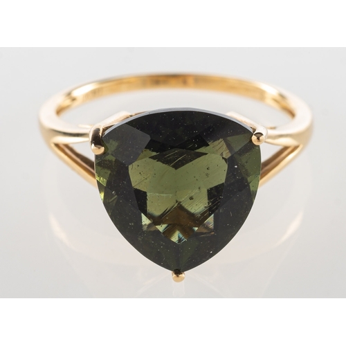 728 - A 9ct gold moldavite single stone ring, claw set with a triangular-cut moldavite, approx. 4.62 carat... 