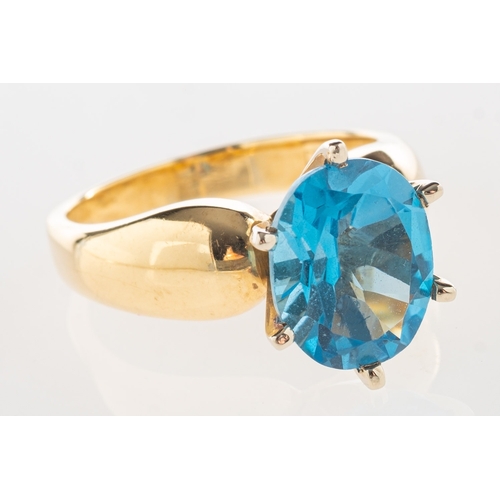 732 - A blue topaz ring, claw set with an oval-cut blue topaz, marked 14K, size N1/2, 6.7grams.