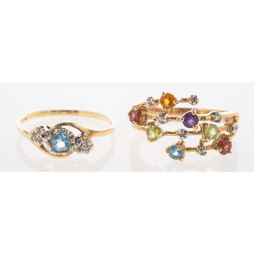 737 - Two gem-set rings, including a 9ct gold three stone twist ring, set with a circular-cut blue topaz, ... 