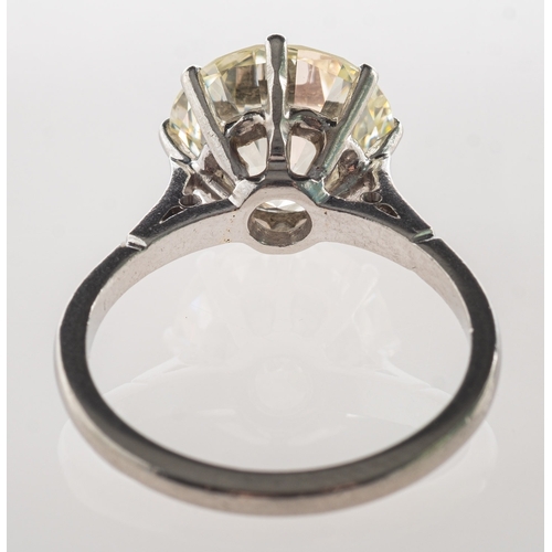 775 - A fine and impressive diamond solitaire ring, eight claw set with a brilliant-cut diamond, diamond a... 